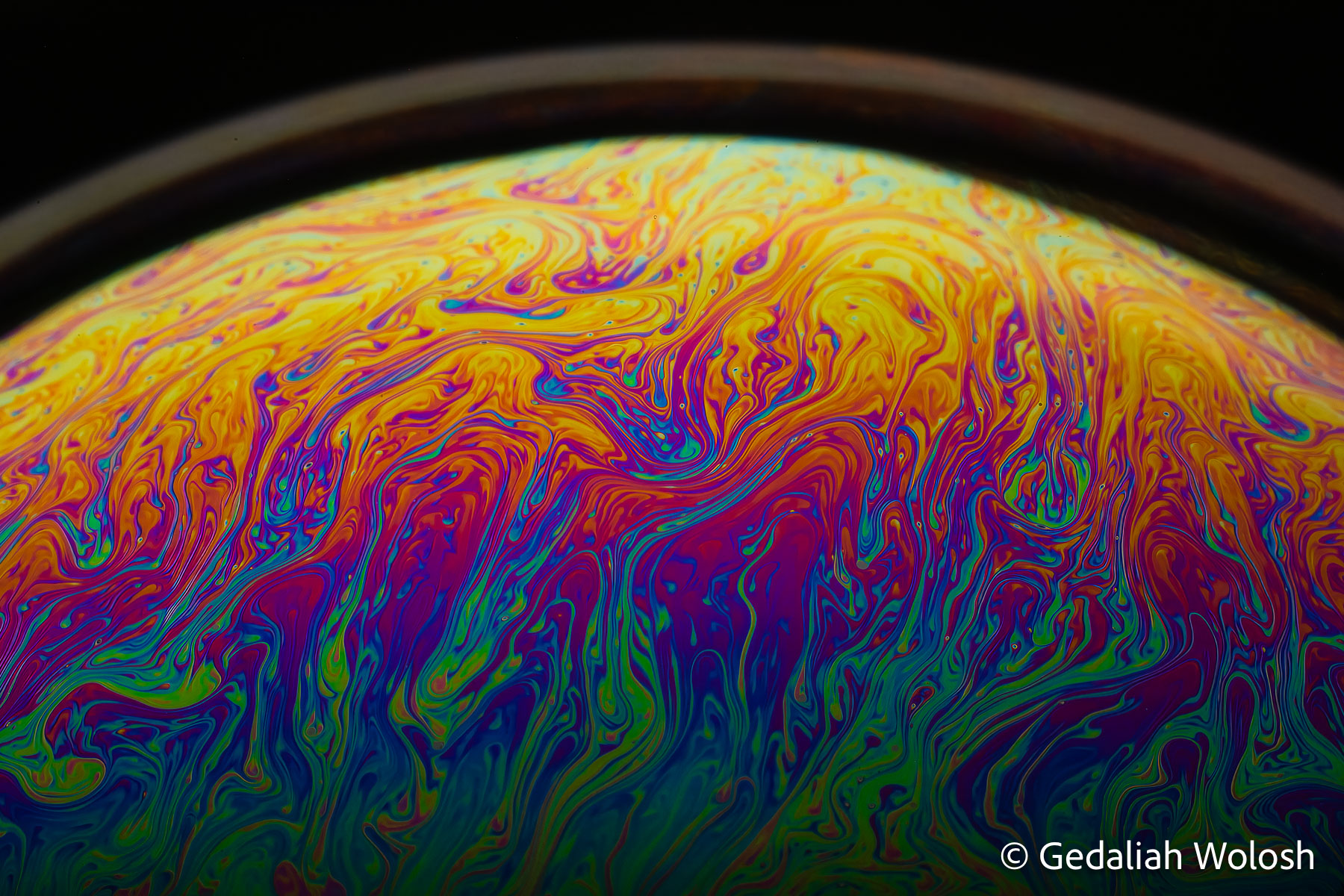 Atmospheric Instability Complex flow patterns emerge within a draining soap film. The colors are produced by thin-film interference as variations in...