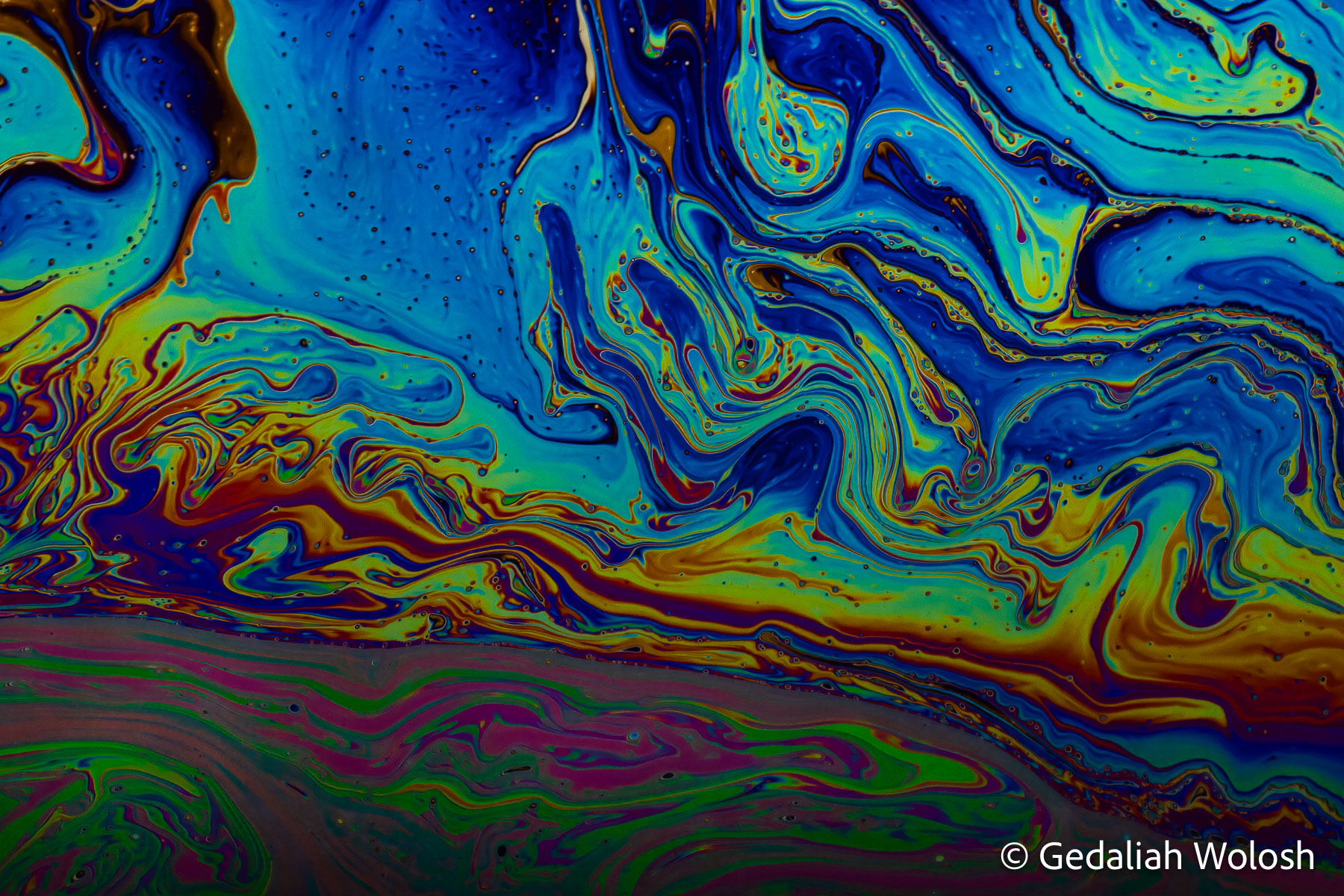 Blue Drift Broad blue regions and winding ribbons of color evoke an aerial view of ocean currents. The composition was formed naturally...