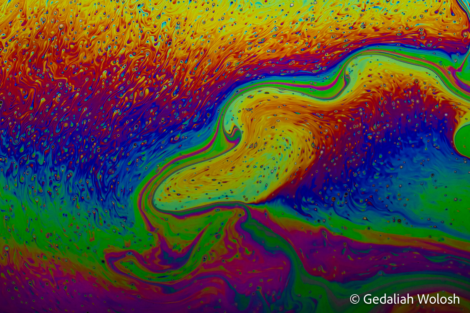 Solar Wind A luminous yellow form sweeps across the frame like charged particles streaming through space. The image records a fleeting arrangement...