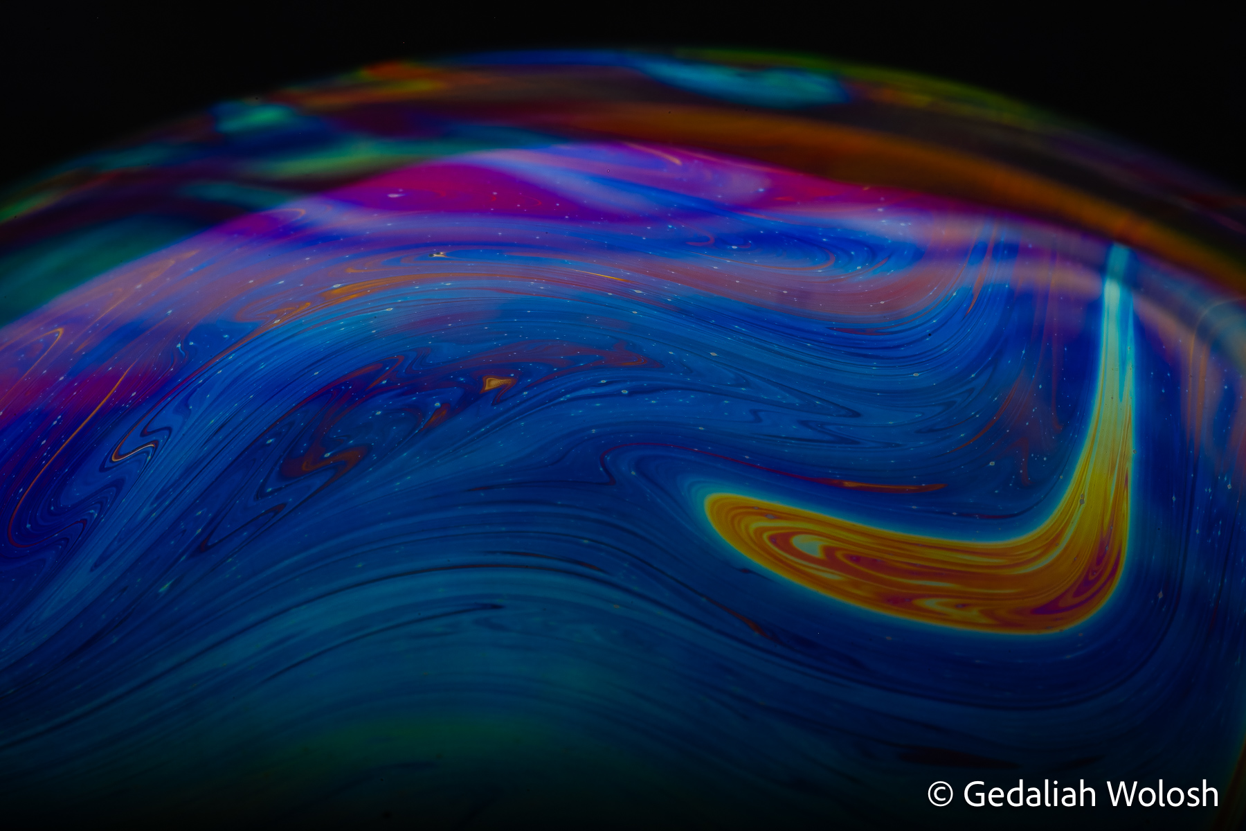 Midnight Current Deep blues and magentas flow across the surface of a slowly evolving bubble, creating the impression of currents moving through...