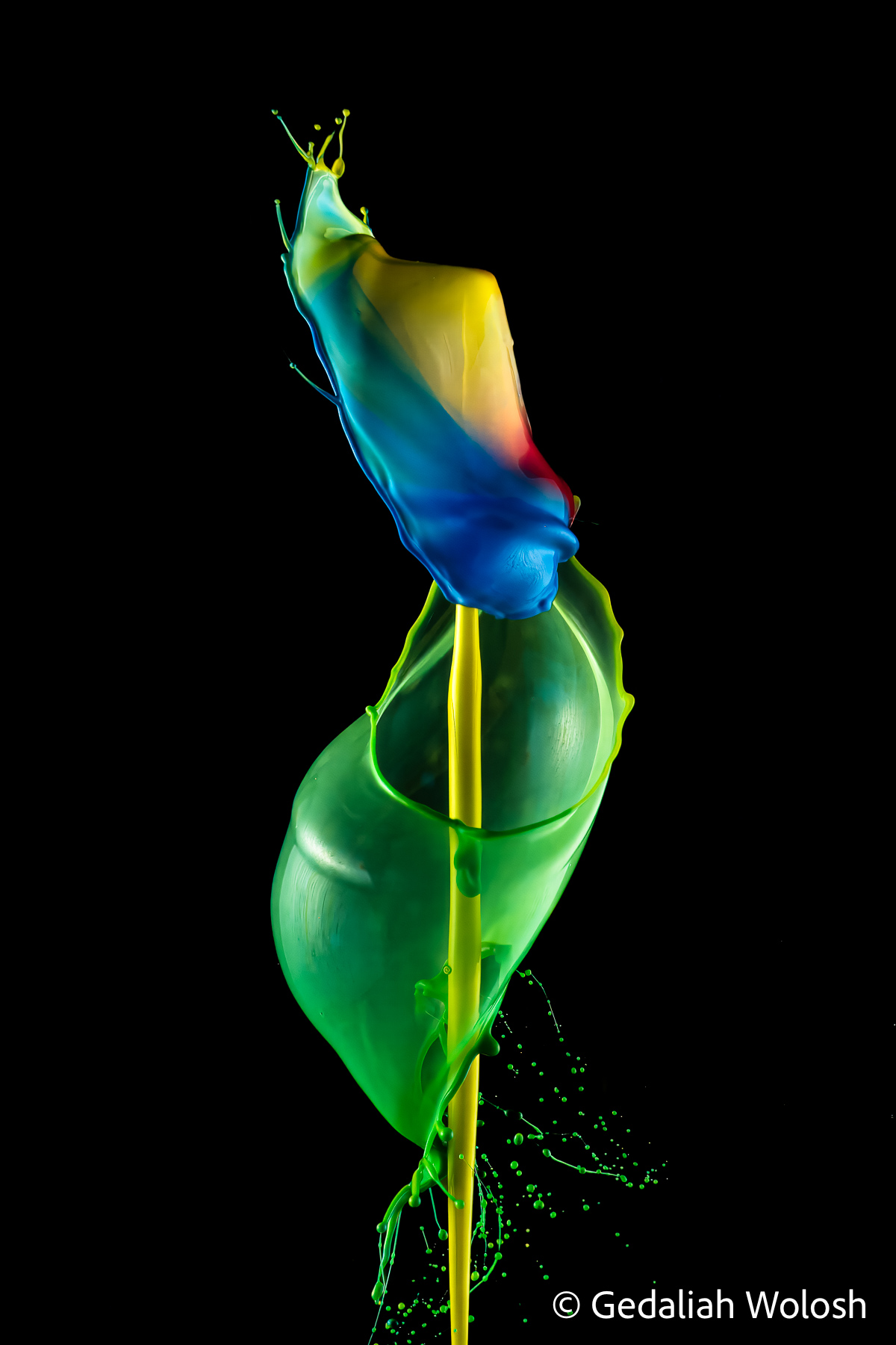 Emergence A folded blue structure rises above a translucent green form, creating an organic composition reminiscent of an opening flower...